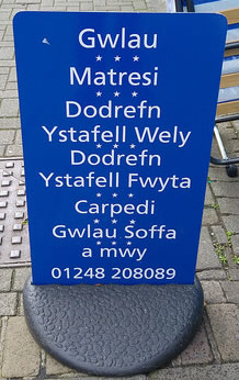 Welsh sign outside a furniture store in Bangor