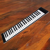 Flat piano on a wooden floor