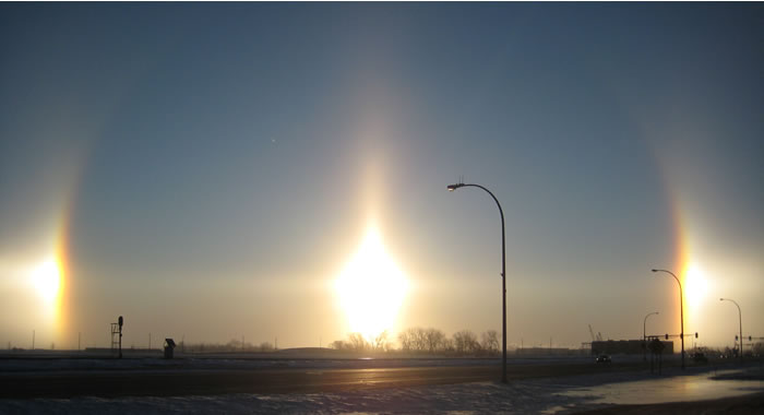 A photo of a sun dogs or parhelion by the sun - from: http://en.wikipedia.org/wiki/File:Fargo_Sundogs_2_18_09.jpg