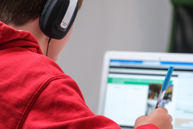 Photo of boy at computer learning stuff